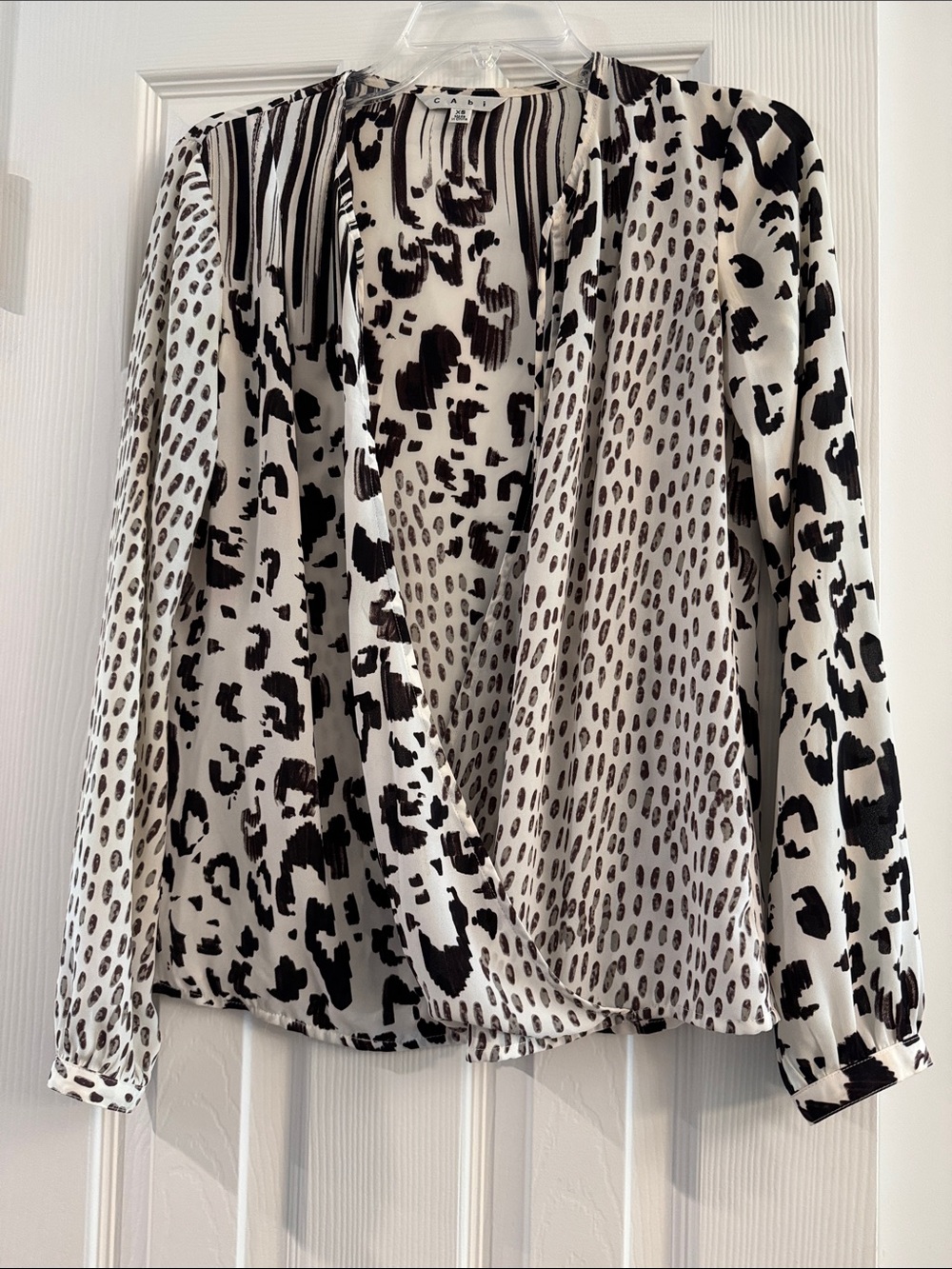 CAbi Black and White Mixed Animal Print Wrap Blouse